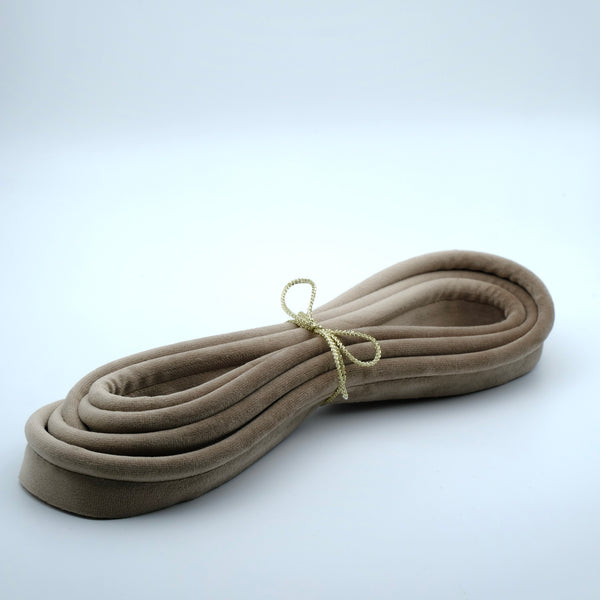 Photo of a bundle of otter coloured velvet piping cord