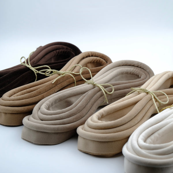 Photos of five bundles of velvet piping cord in warm natural colours