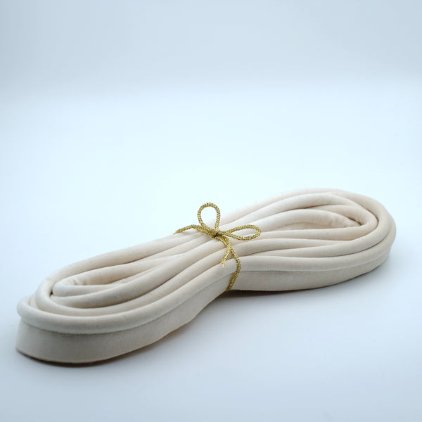 Photo of a bundle of oyster coloured velvet piping cord