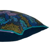 Side shot of a cushion made from a 1970s printed damask in bright blue and purple