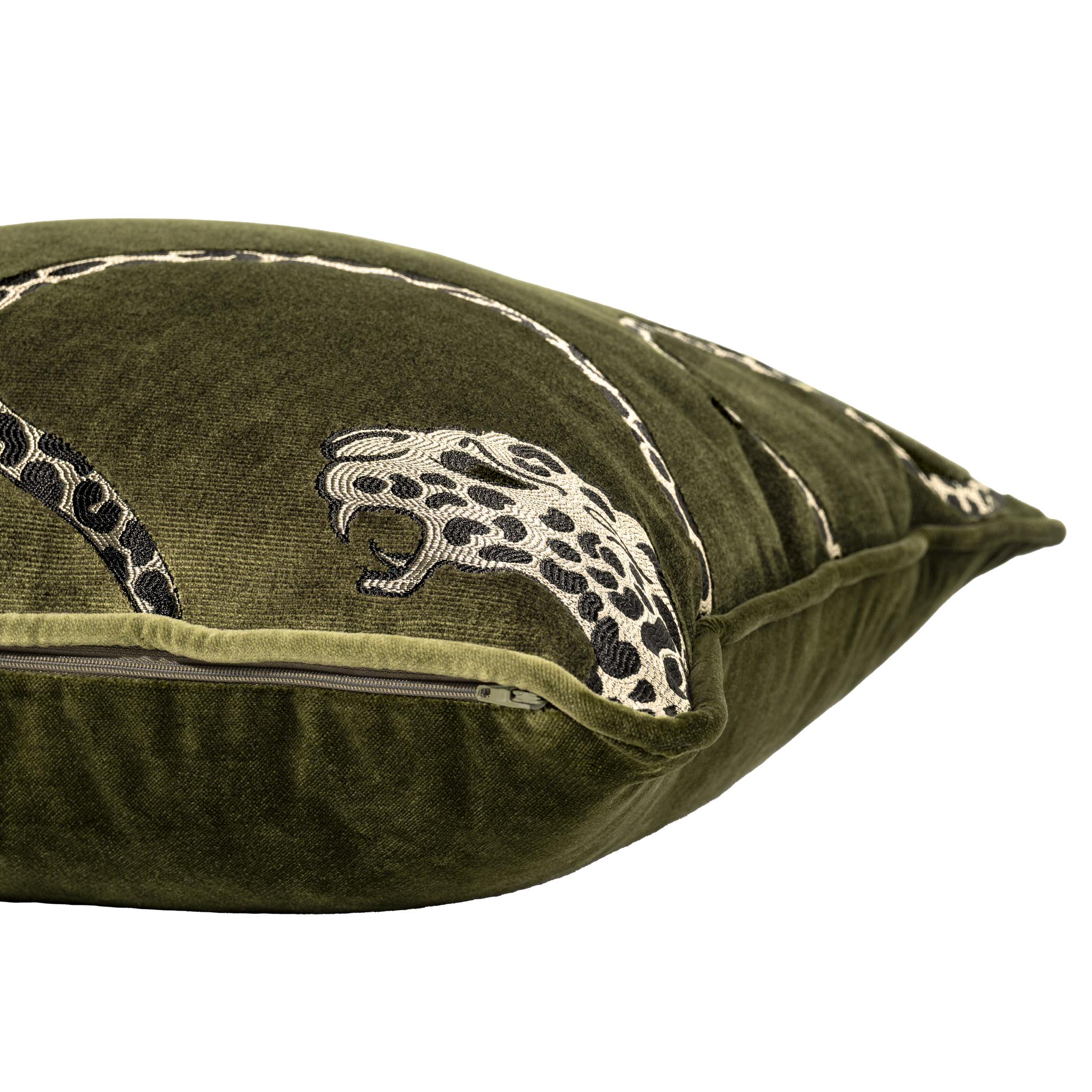Green pillow with embroidered leopard design on a white background