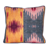 Decorative cushion with a geometric ikat pattern 
