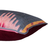 Decorative cushion with a geometric ikat pattern 