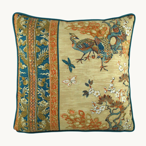 photo of a cushion with peacocks and cherry blossoms with an oriental decorative border