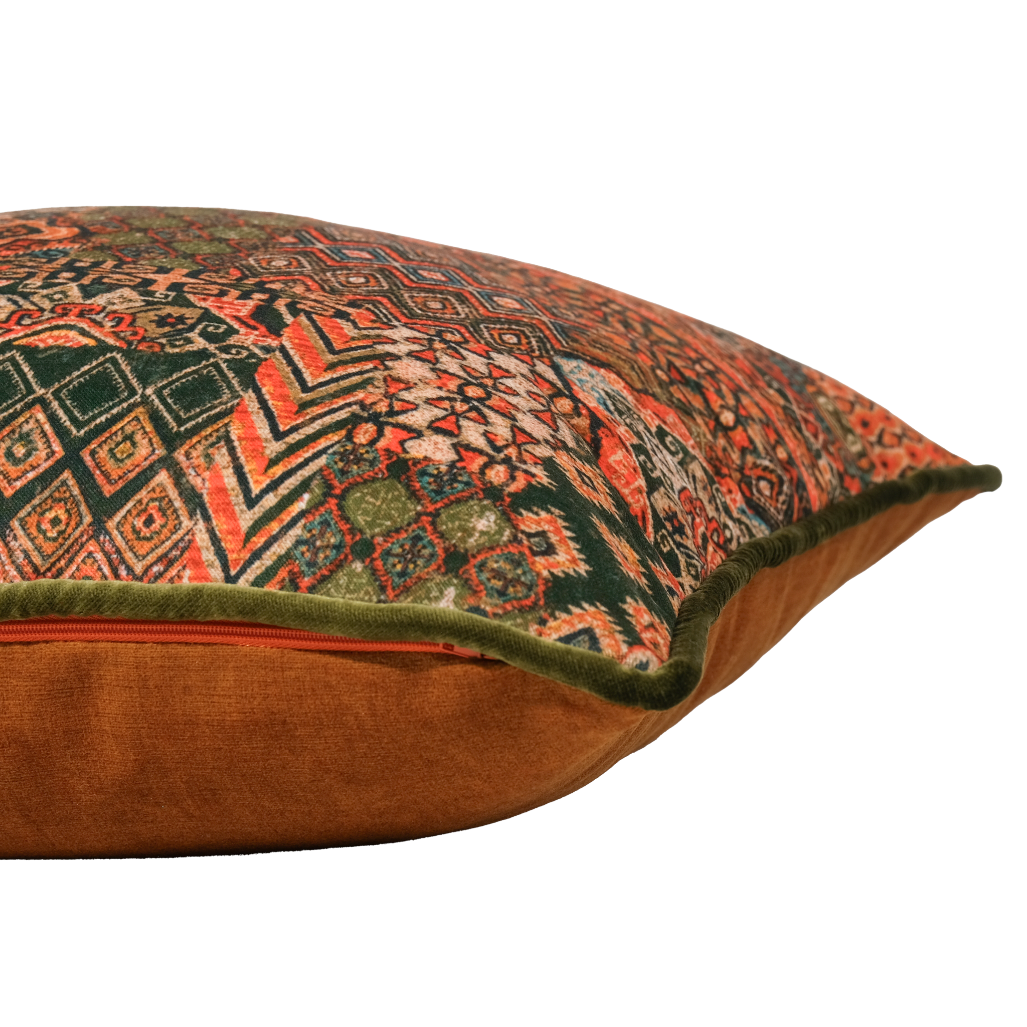 Side shot of a decorative cushion with intricate Persian geometric patterns in orange and green and caramel colours