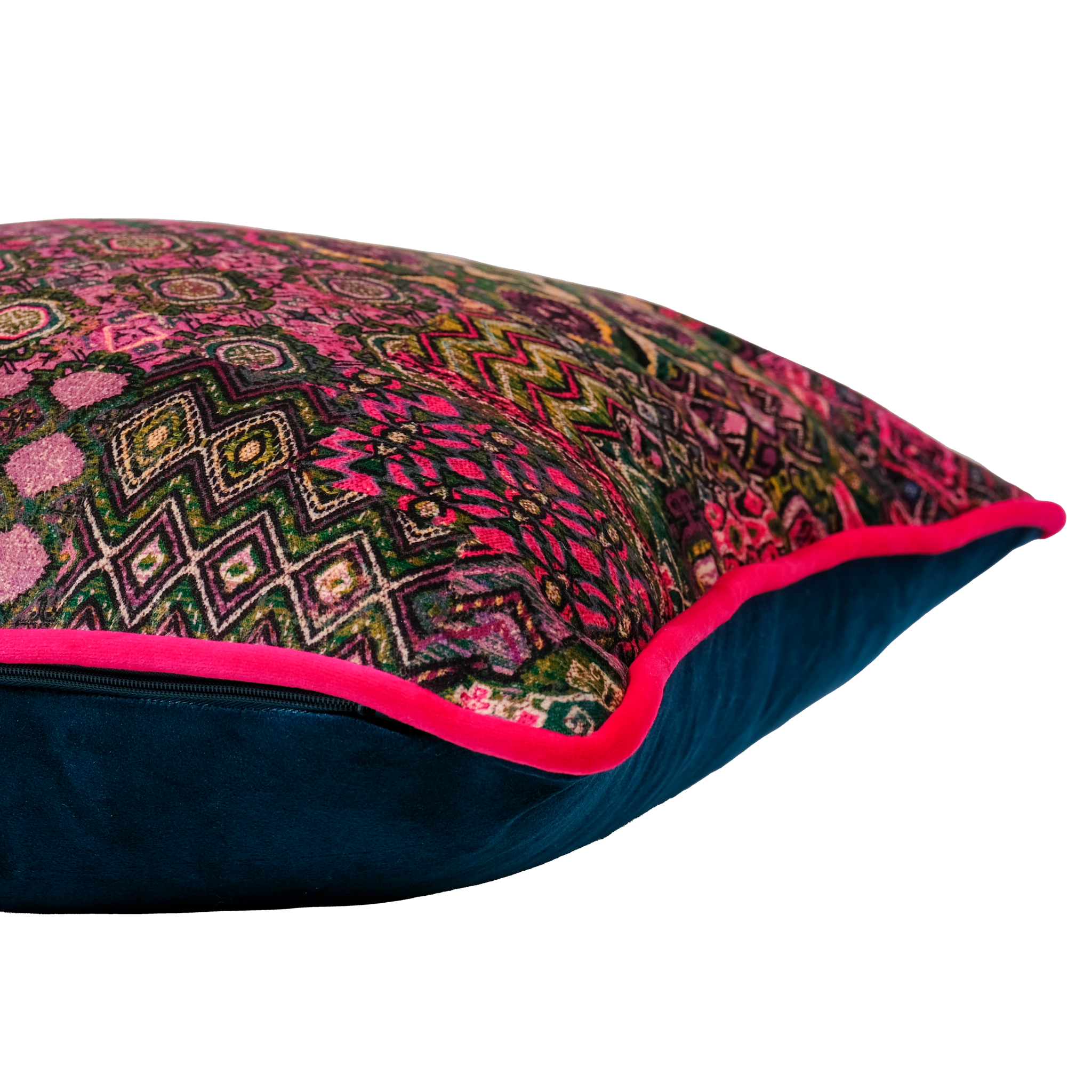 Side shot of a decorative cushion with a colorful Persian geometric pattern in hot pink, purple and emerald.