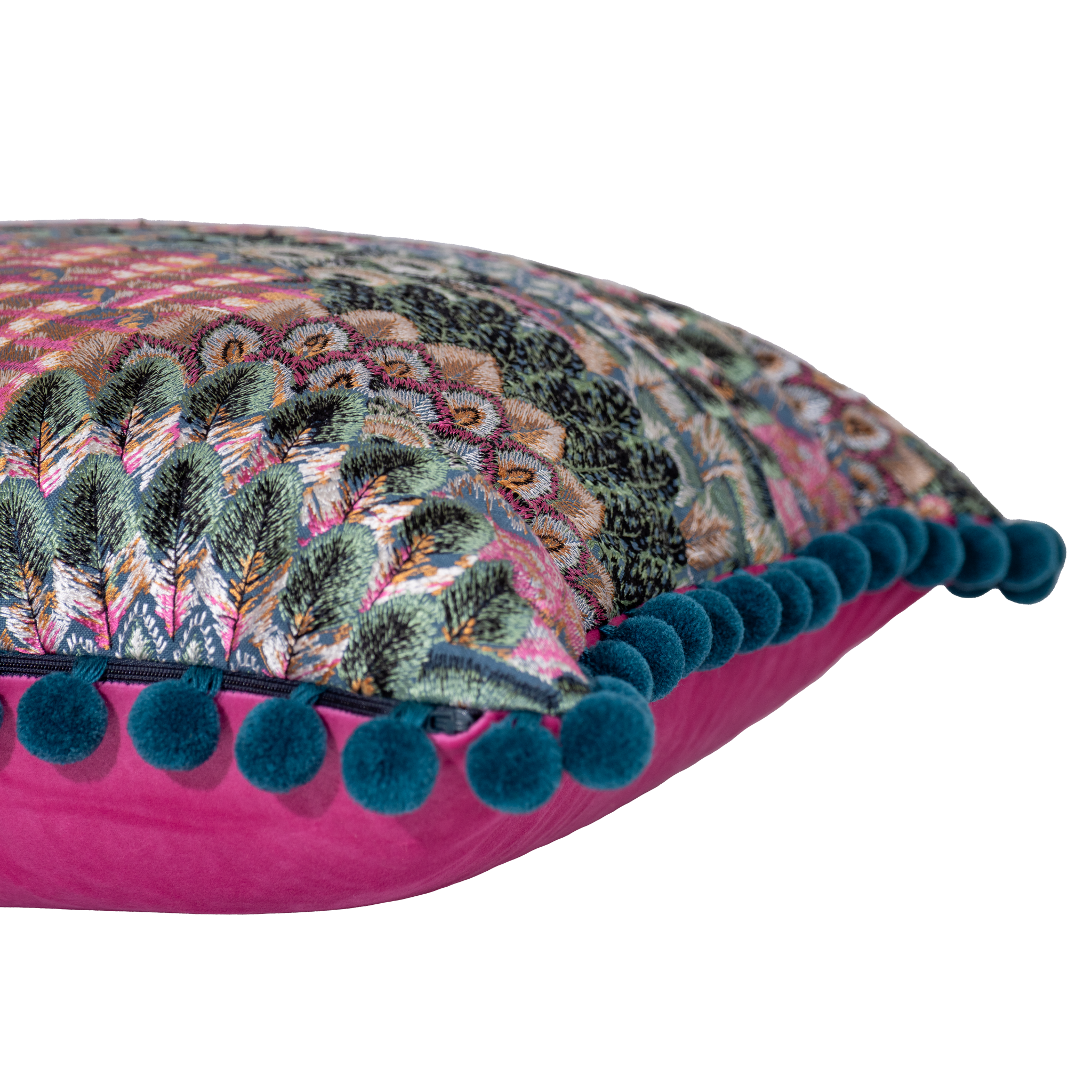 Decorative pillow with an embroidered feather pattern and teal pom-pom trim 