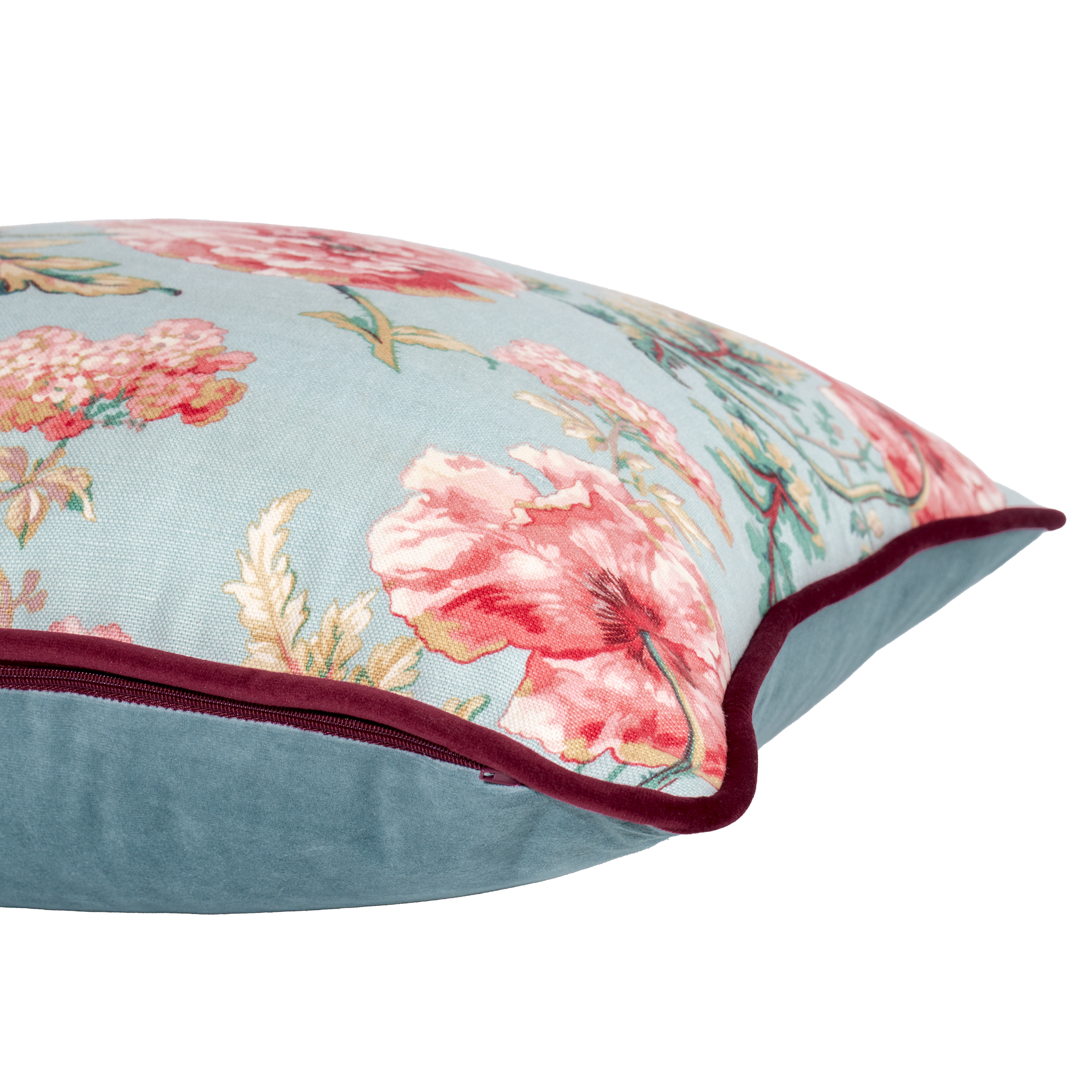 Floral-patterned pillow with pink flowers on a light blue background