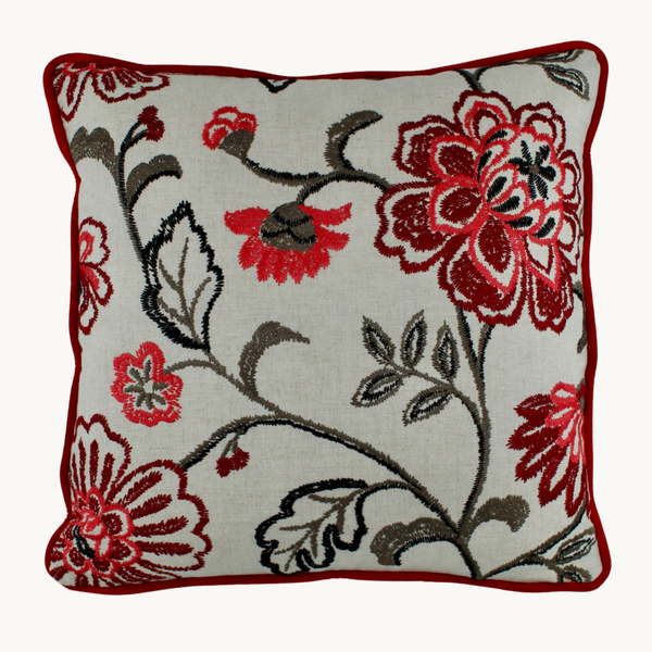 Photo of a floral cushion with red embroidered flowers