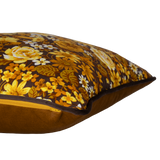 Side view of a 1970s inspired medium scale floral in bright yellow and ochre with a chocolate brown background