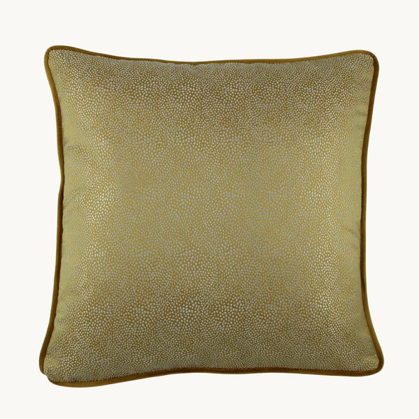 Photo of a cushion in a textured gold spot