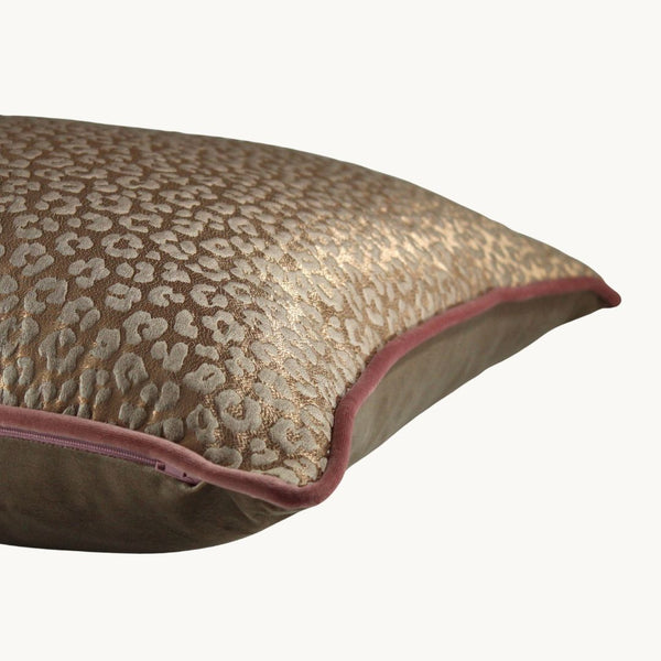 Side shot of a rose gold leopard print cushion