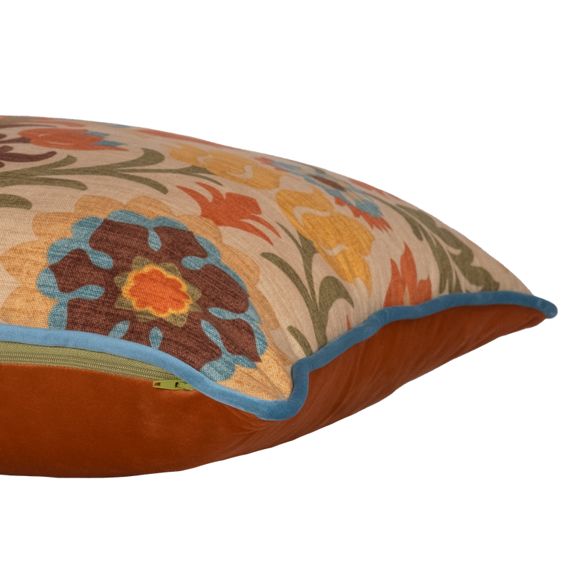 Side shot of a decorative cushion with a spanish inspired damask in autumn colours