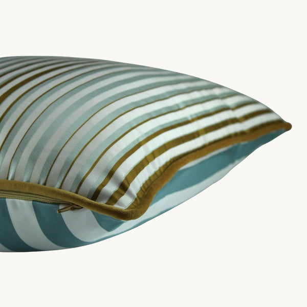 Side shot of a striped cushion in duck egg blue, gold and white