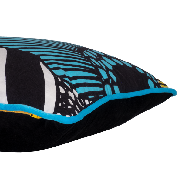 Close-up of a pillow with black, blue, and white pattern on a white background