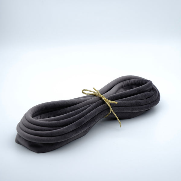 photo of a bundle of slate grey velvet piping