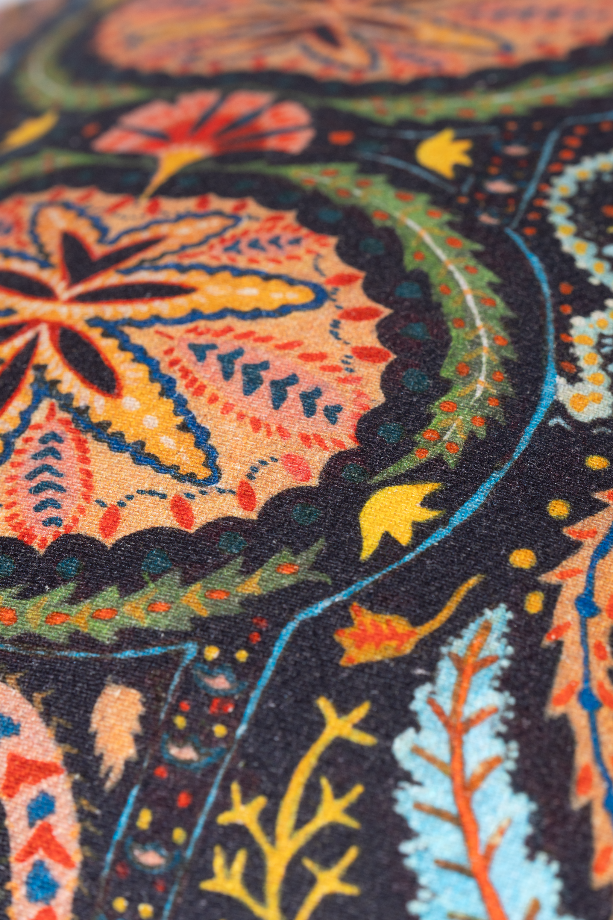 Close-up of a colorful patterned fabric with intricate designs.