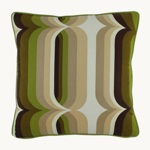 Photo of a cushion with an graphic 1970s design in shades of green and neutrals