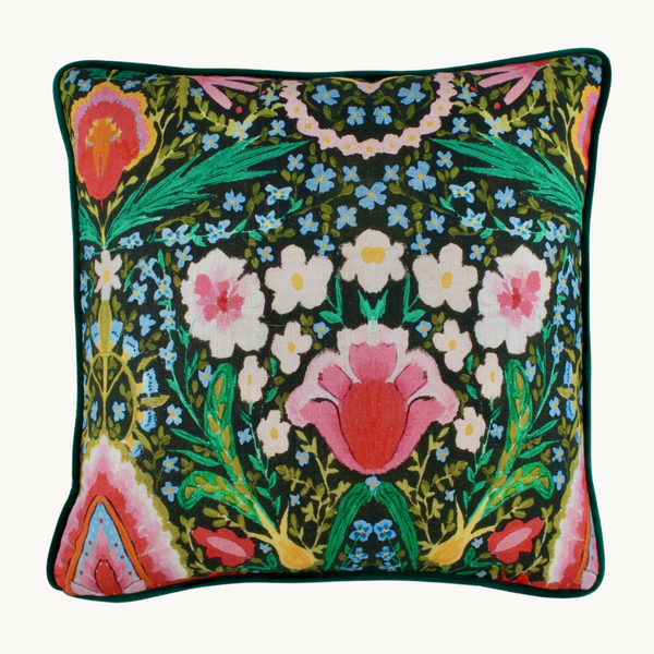 Photo of a brightly coloured cushion with flowers and peace signs