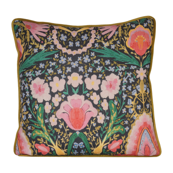 Photo of a brightly coloured cushion with flowers and peace signs