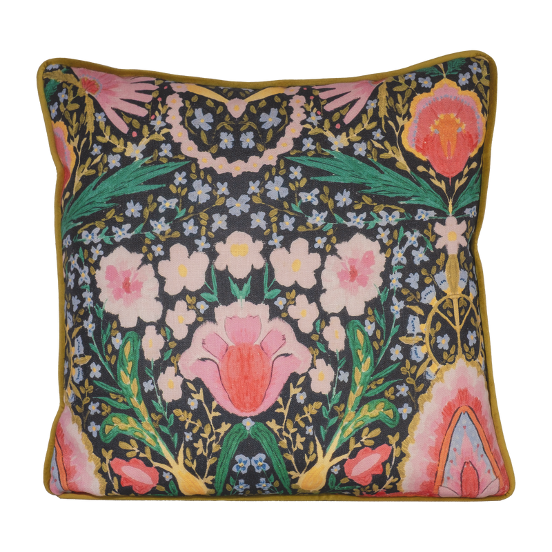 Photo of a brightly coloured cushion with flowers and peace signs
