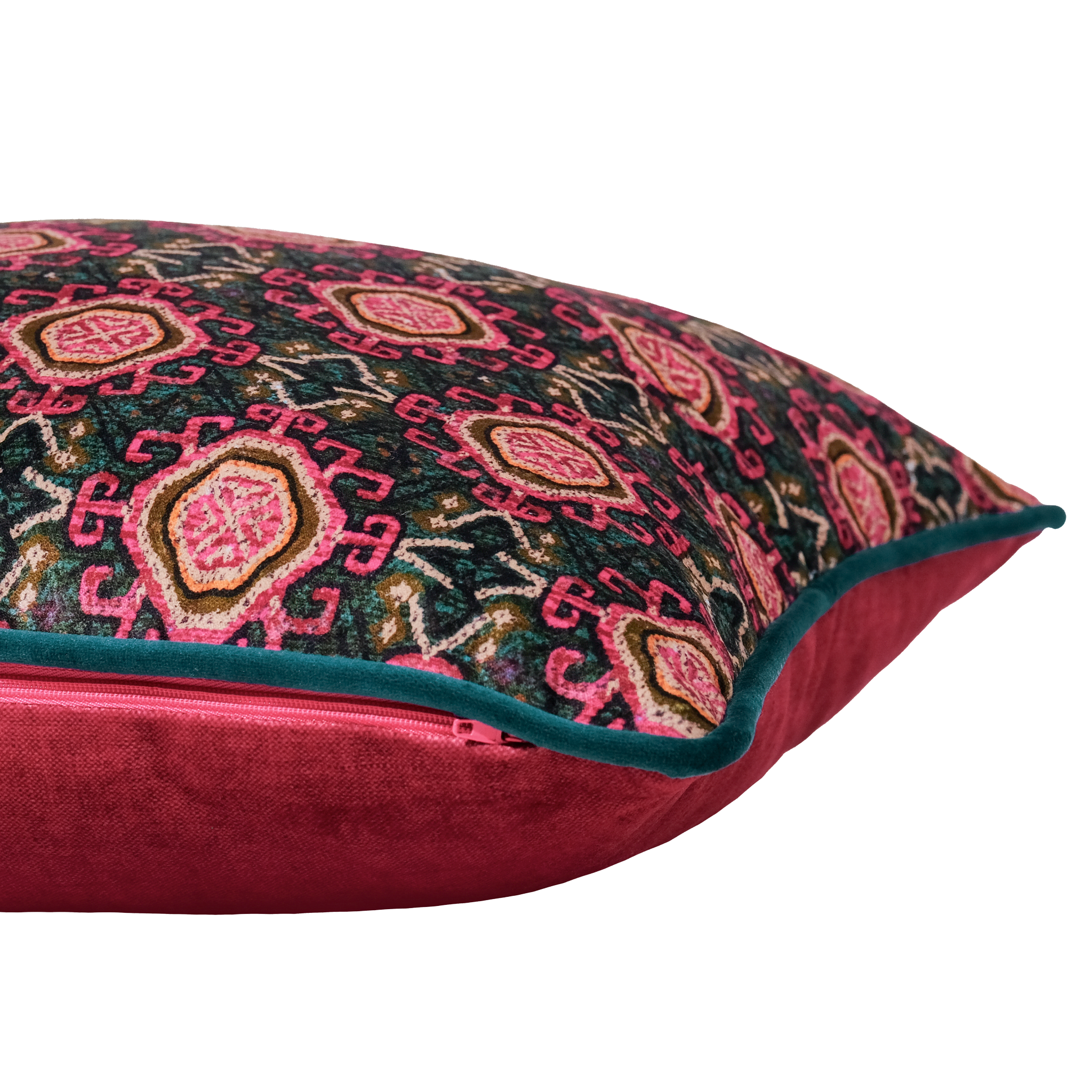 Side shot of a decorative cushion with a pink and teal Persian geometric pattern