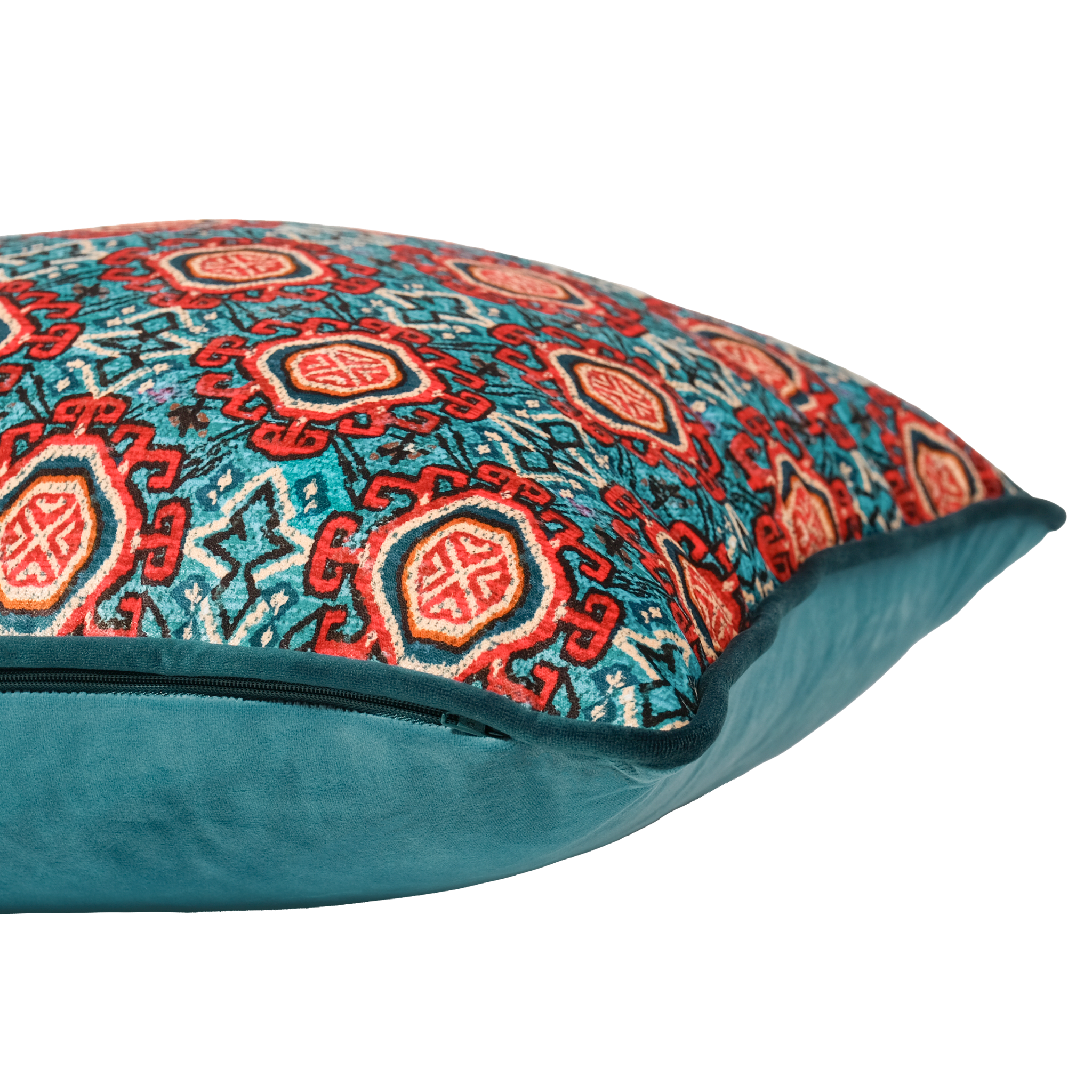 Side shot of a decorative pillow with a red and aqua Persian geometric pattern