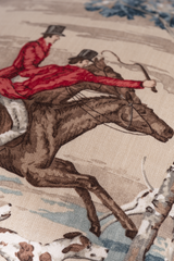Close up of a printed linen featuring a classic english hunting scene