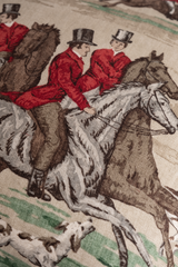 Close up of a printed linen featuring an English hunting scene