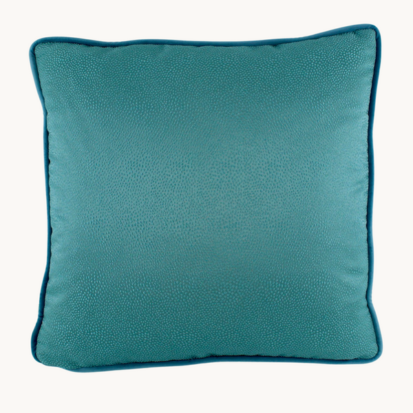 Photo of a cushion with a diffuse topaz blue textured spot.