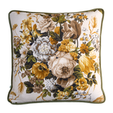 Floral patterned pillow with yellow, white, and green flowers on a white background