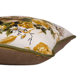 Side shot of a floral cushion with green and gold and neutral colours