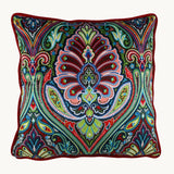 photo of a brightly coloured velvet cushion with a design inspired by motifs from the Ottoman Empire.