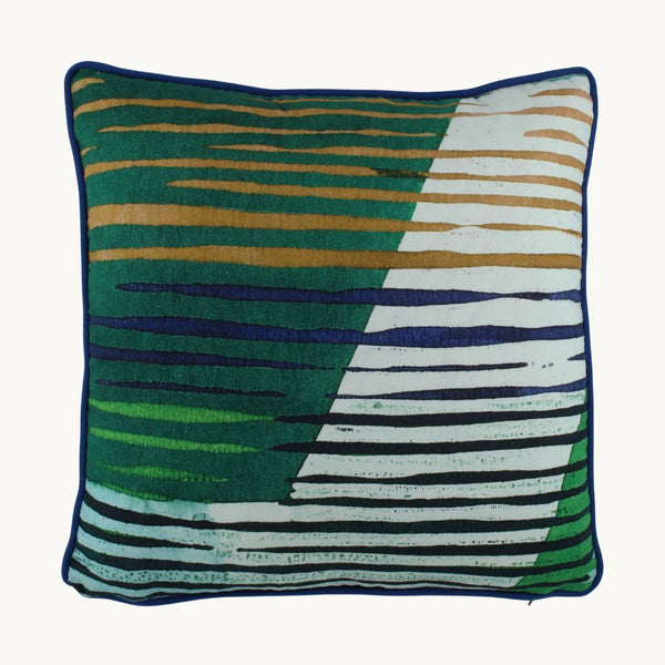 Photo of a geometric cushion in greens and blues