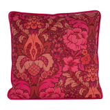 Photo of a cushion made from a punchy vintage damask in hot pink, coral and red
