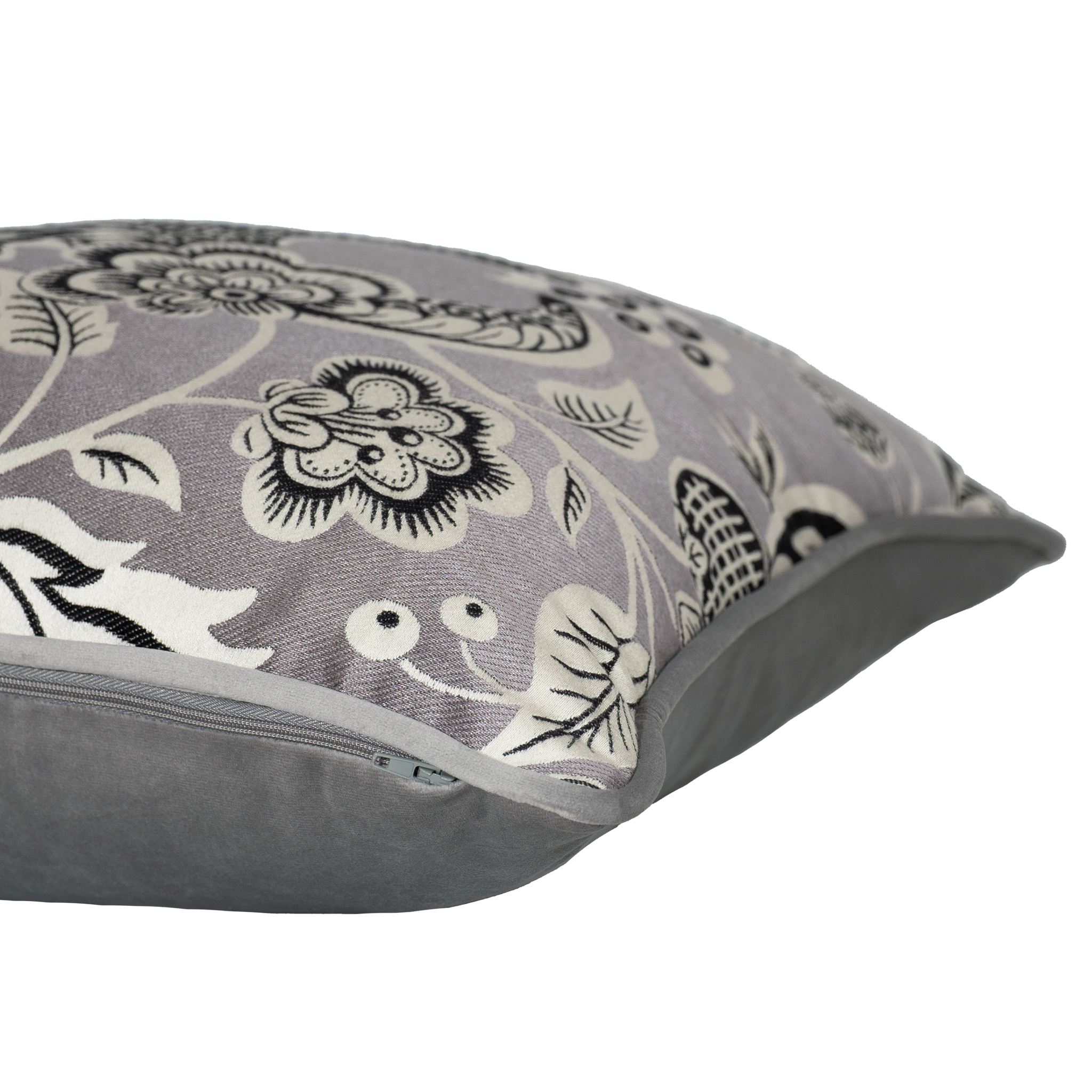 Gray pillow with black floral pattern on a silver background