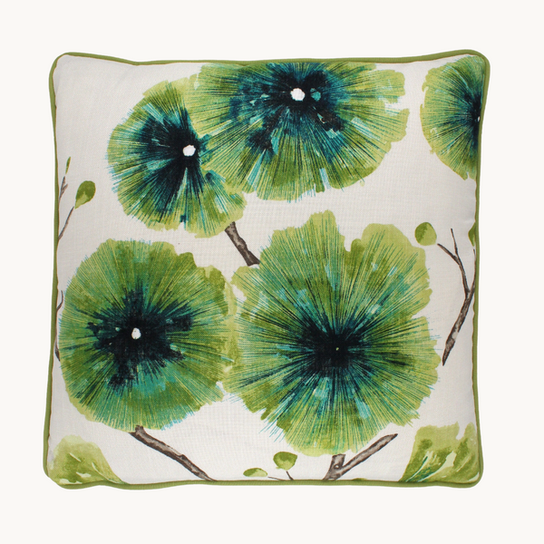 Photo of floral cushion featuring large scale exotic flowers in a bright gooseberry colour on a white background