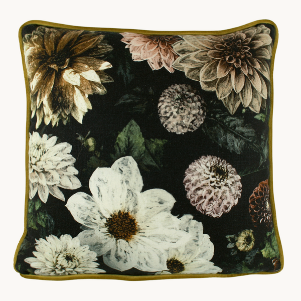 Photo of a square cushion with a black background and sepia toned dahlias