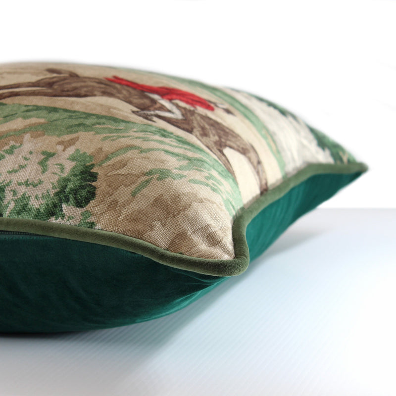 Side shot of a linen cushion with emerald velvet back and English hunting scene on the front 